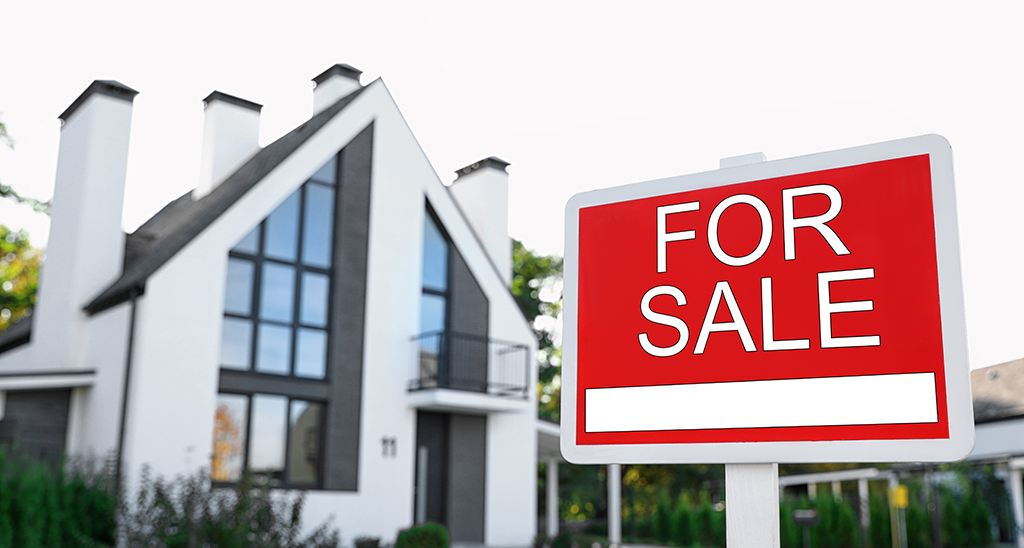Modern property has a house for sale sign in front garden, to sell your house fast contact Derby's local experts, Cash Property Buyer